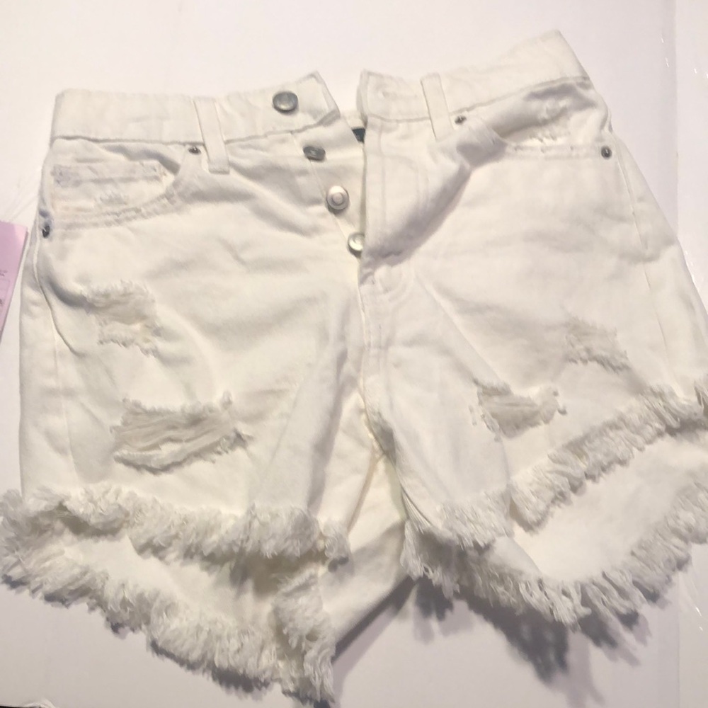 Woman’s white highest rise white distressed shorts